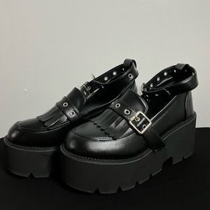Black platform shoe with ankle strap